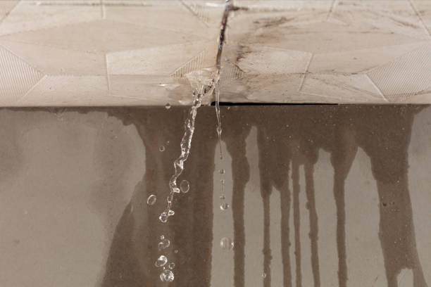 Professional Flood Damage Cleanup technician working in Winsted, CT